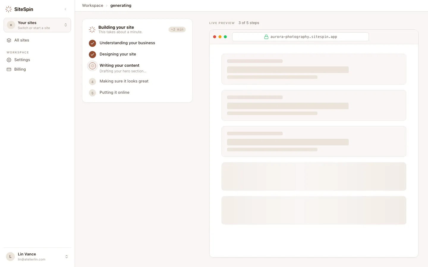 SiteSpin web app showing site generation in progress with the message 'Drafting your hero section…'.